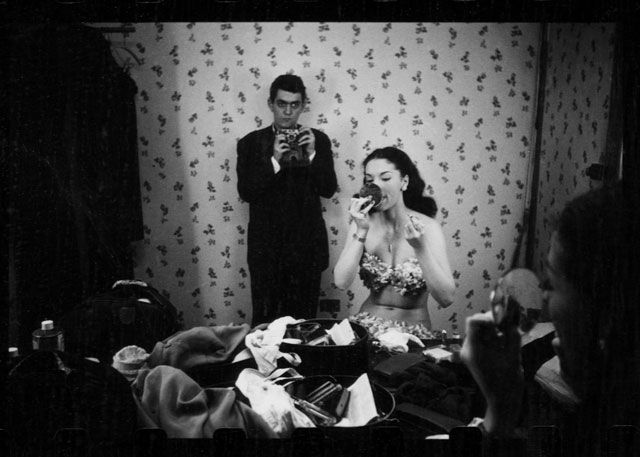 Stanley Kubrick, reflected in mirror, photographing showgirl Rosemary Williams, 1949. Photographer: Stanley Kubrick. Museum of the City of New York, LOOK Collection.
